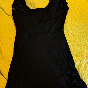 Black flowy top with open back and bow
